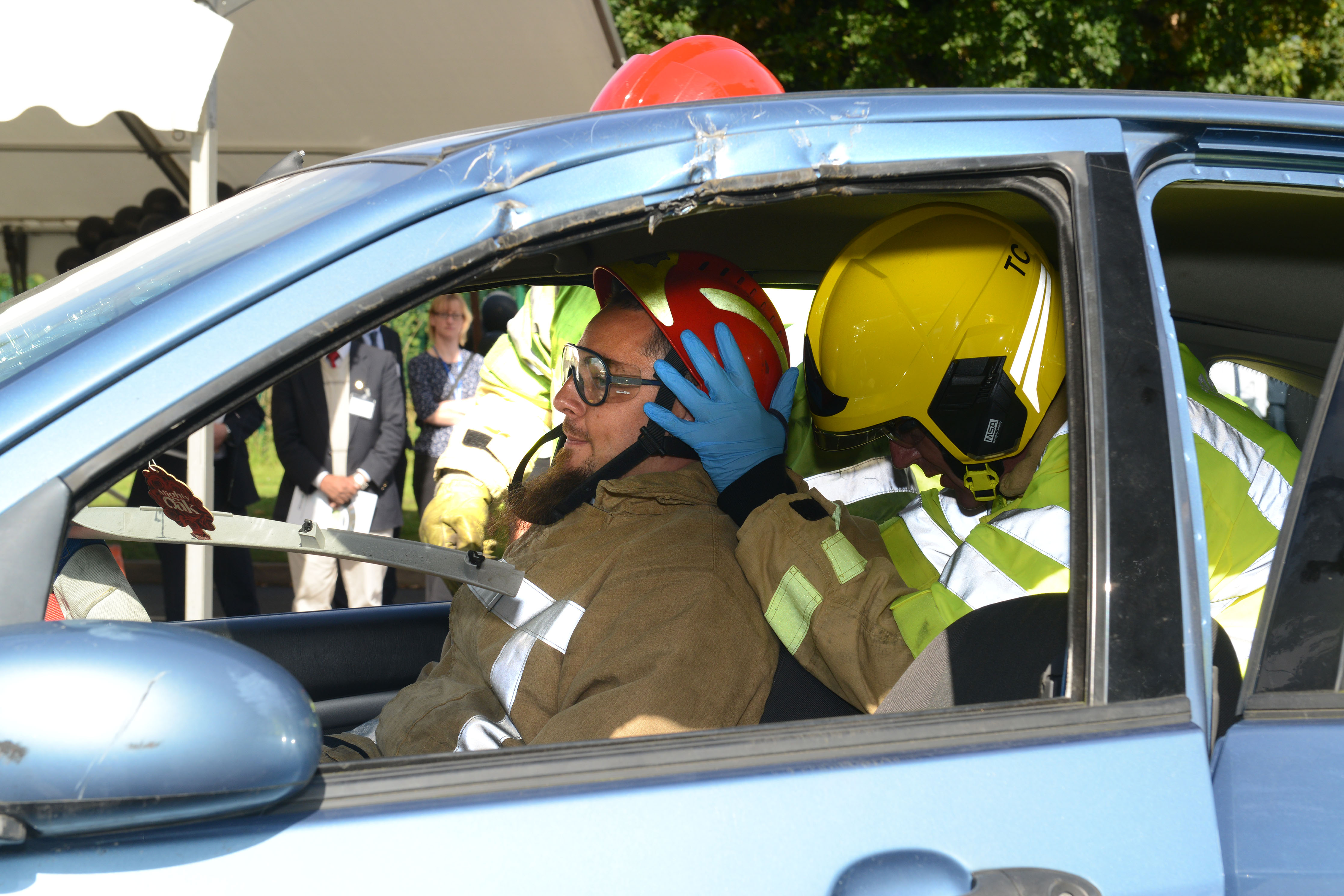 Lord Digby Jones with left to right Shropshire Chief Fire Officer John Redmond and TTC Group Road Safety Director Alan Prosser with firefighters after a car extrication demo as part of the business driver road safety campaign. 