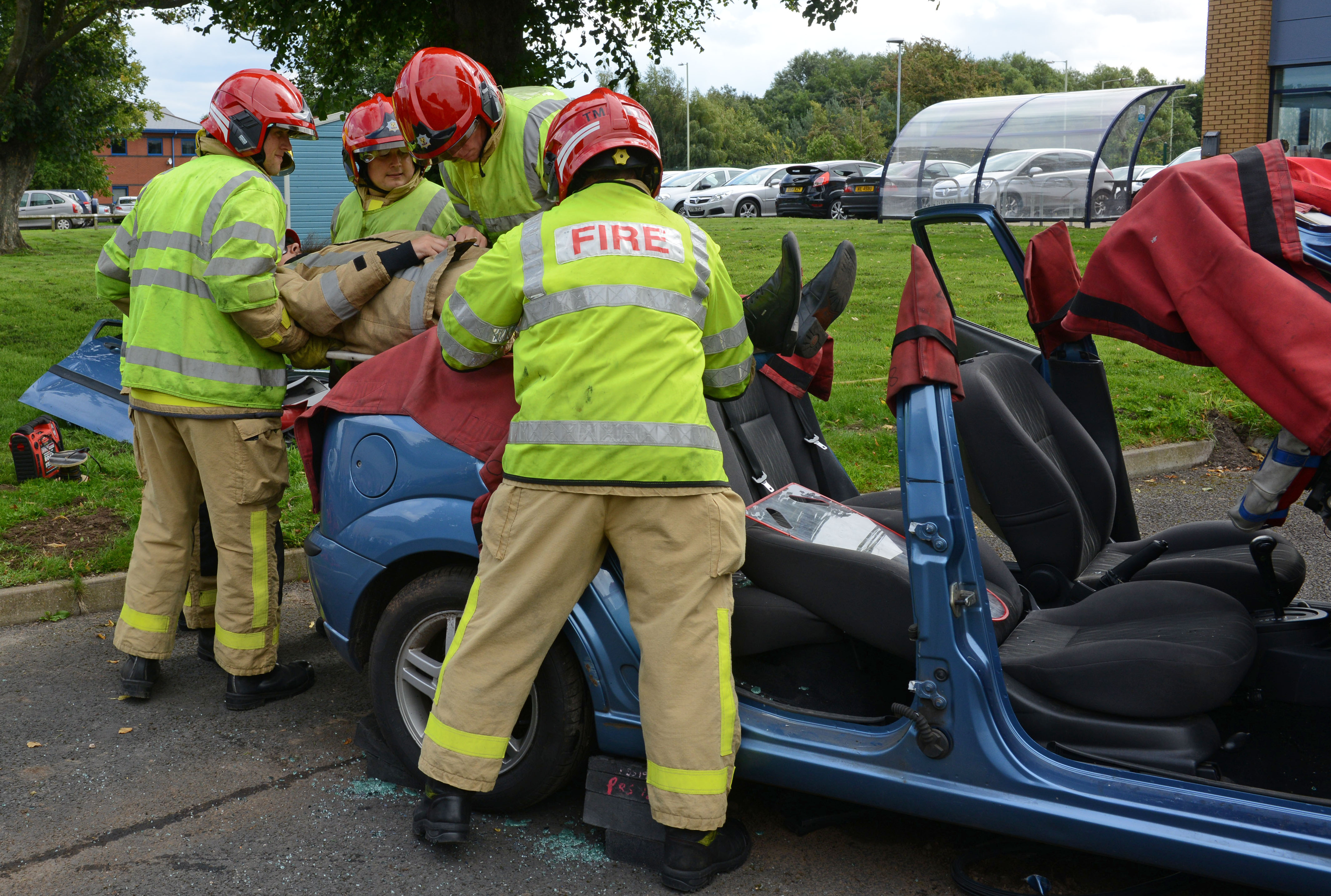 Lord Digby Jones with left to right Shropshire Chief Fire Officer John Redmond and TTC Group Road Safety Director Alan Prosser with firefighters after a car extrication demo as part of the business driver road safety campaign. 