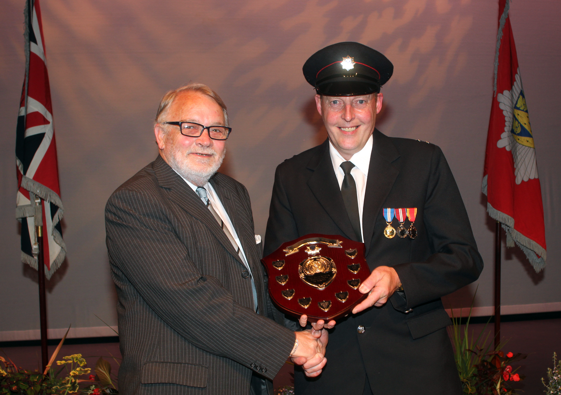 Alan Smith receives the Telent Shield for raising £42,000 for charity