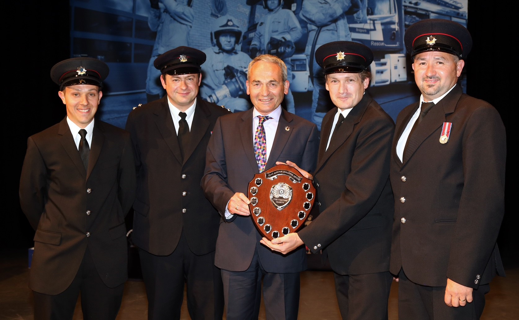 Councillor Keith Roberts (centre) presents the Dave Bishton Challenge Shield to Bridgnorth Fire Station's Joe Smallman, Ashley Brown, Steve Power and Ian George.