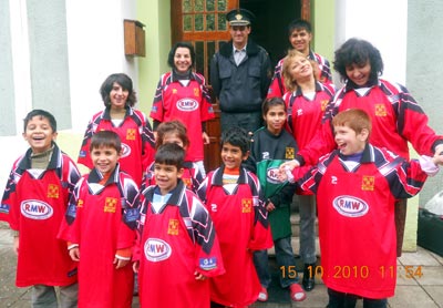Orphanage children in Shrewsbury Town FC strip, staff and Ruse firefighter