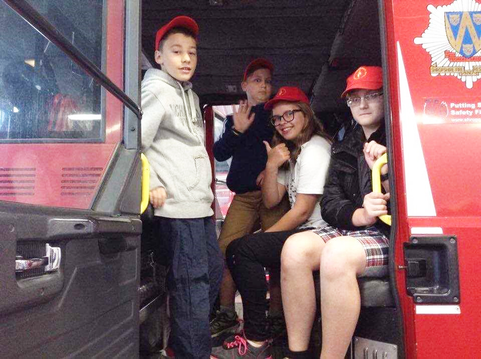 All aboard a fire engine at Shrewsbury Fire Station for the Belarus children. 