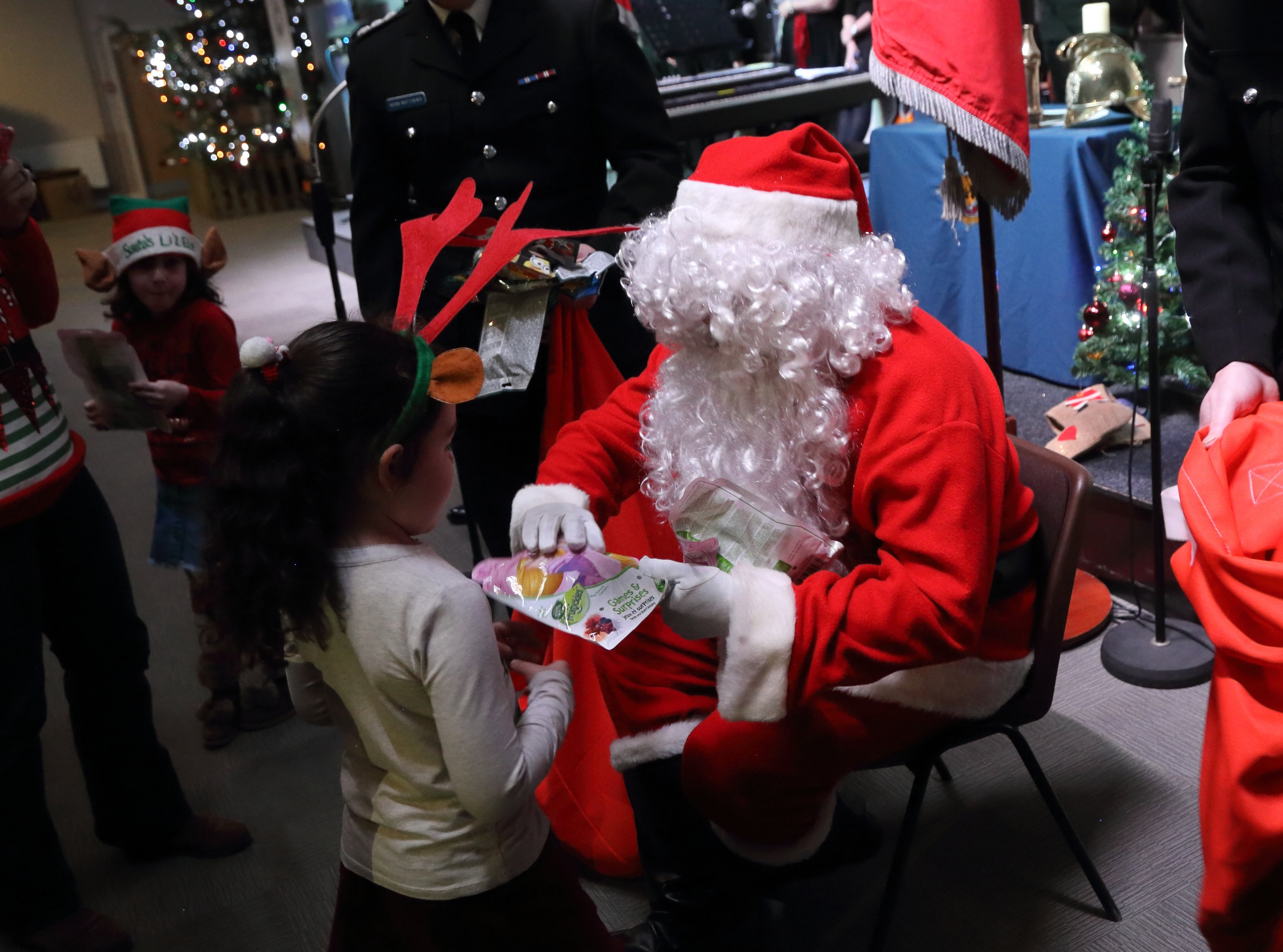 Father Christmas hands out presents