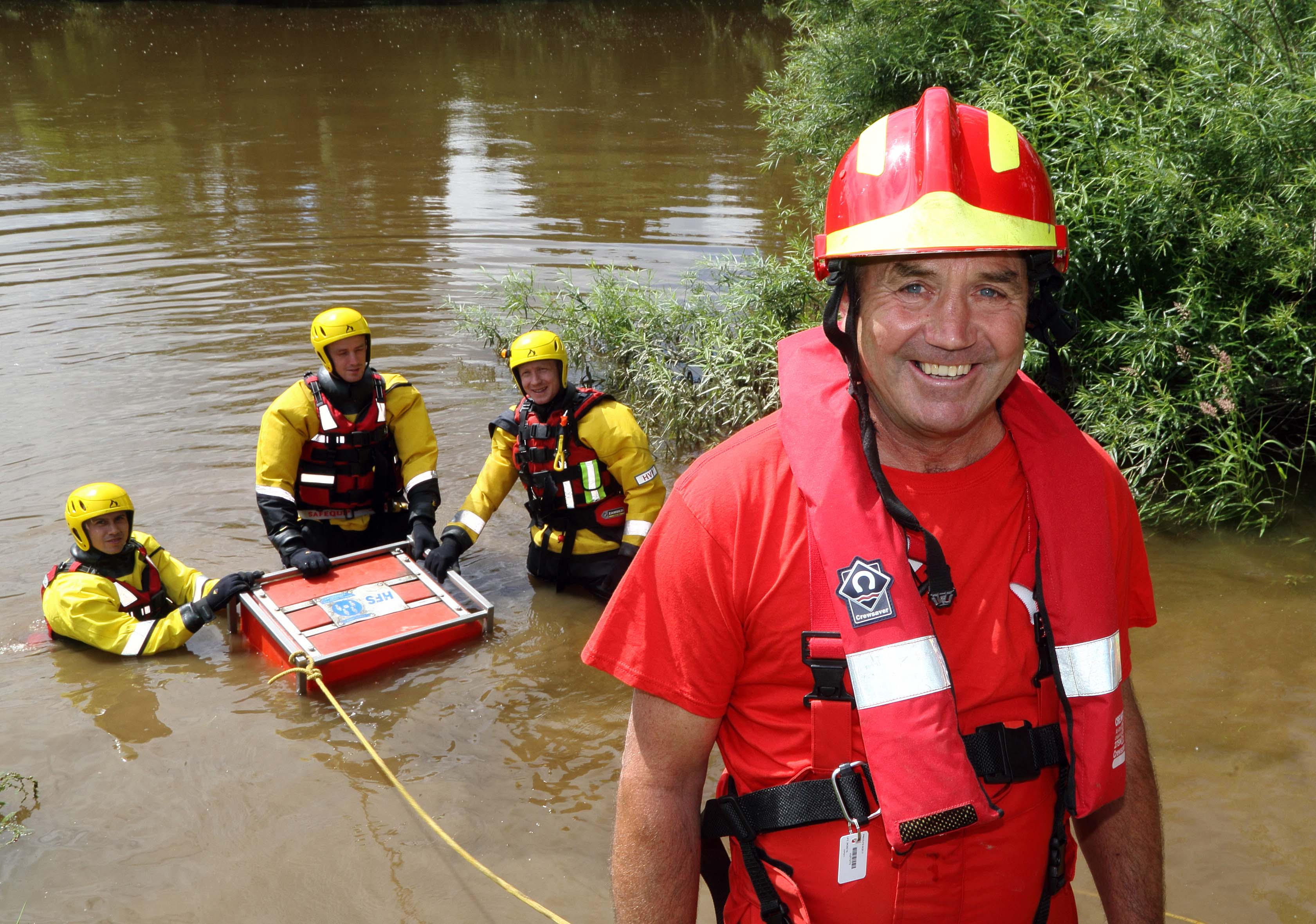 Tactical advisor Mac Harris with firefighters at the West Midlands showground by the River Severn in Shrewsbury, in training for the next floods disaster
