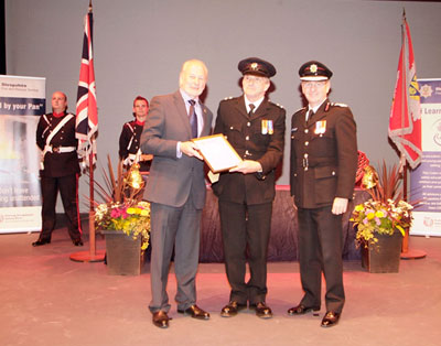 Pete Langford receiving award from Stuart West and Paul Raymond