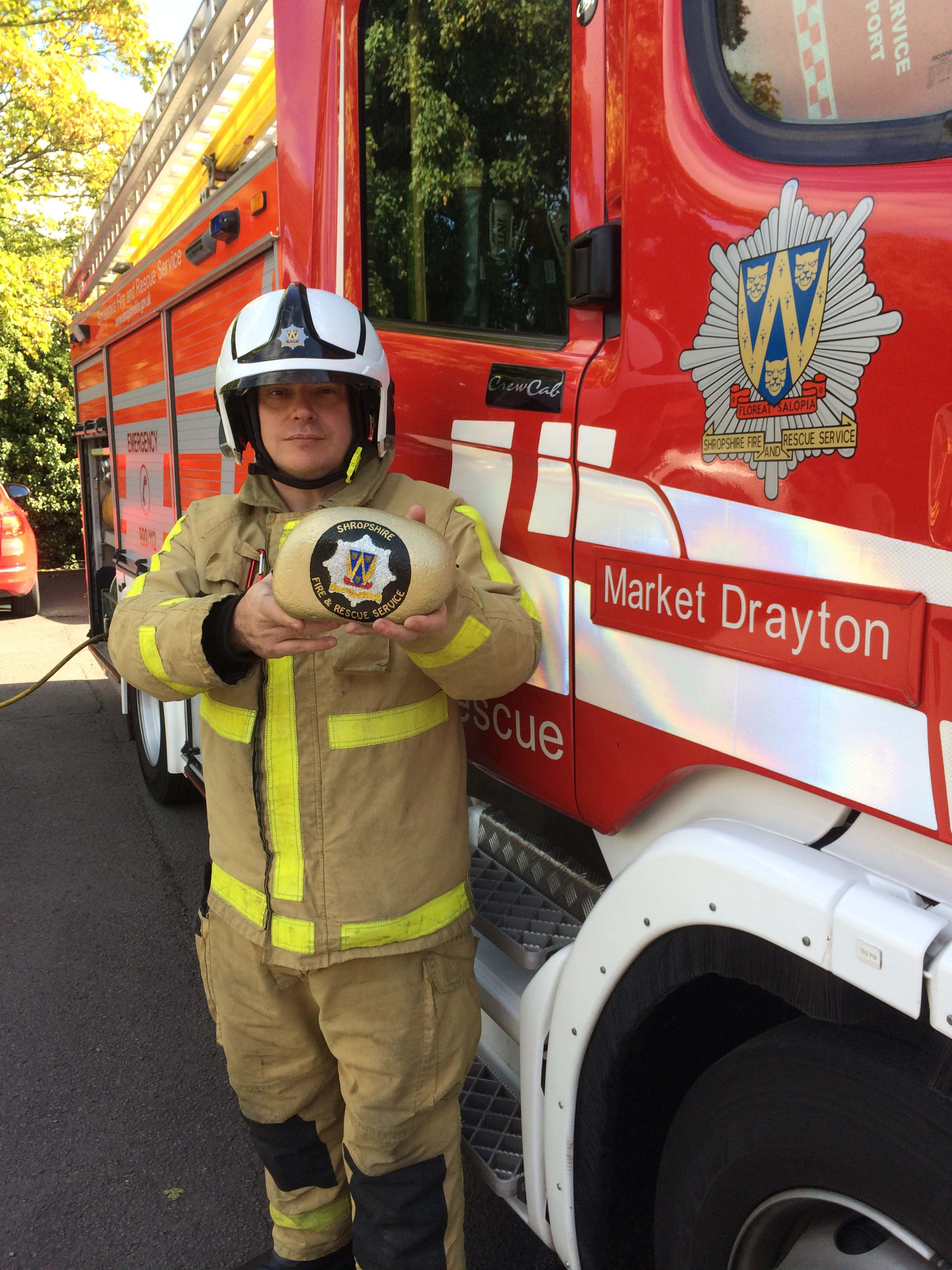 Firefighter Mark Smith with the golden rock