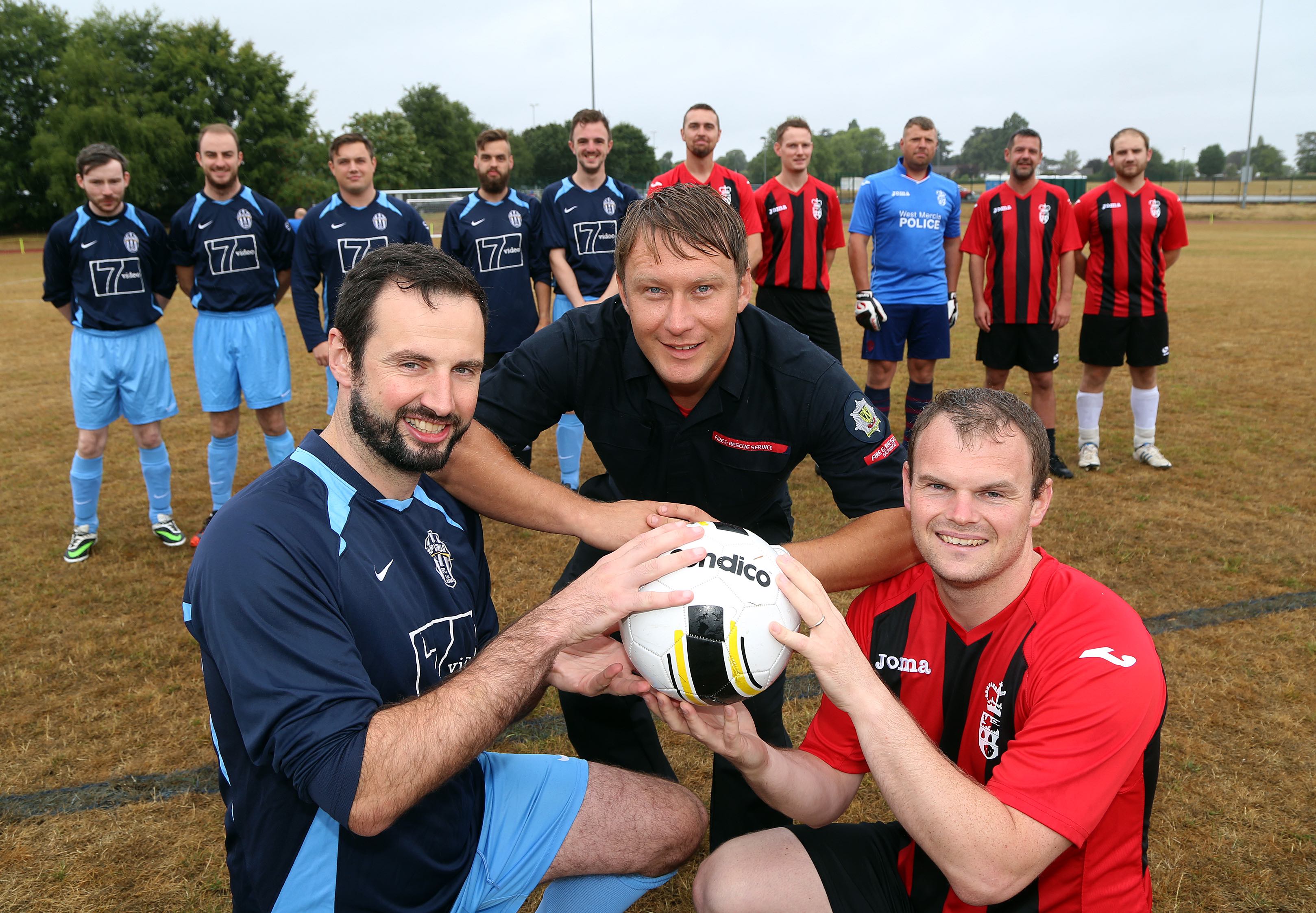 Police officer Jamie Adams with firefighter Andy Davies and Shropshire Council's Rob Jones at the football knockout competition won by the RAF team