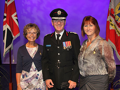 Lynn and Yvonne standing either side of Paul