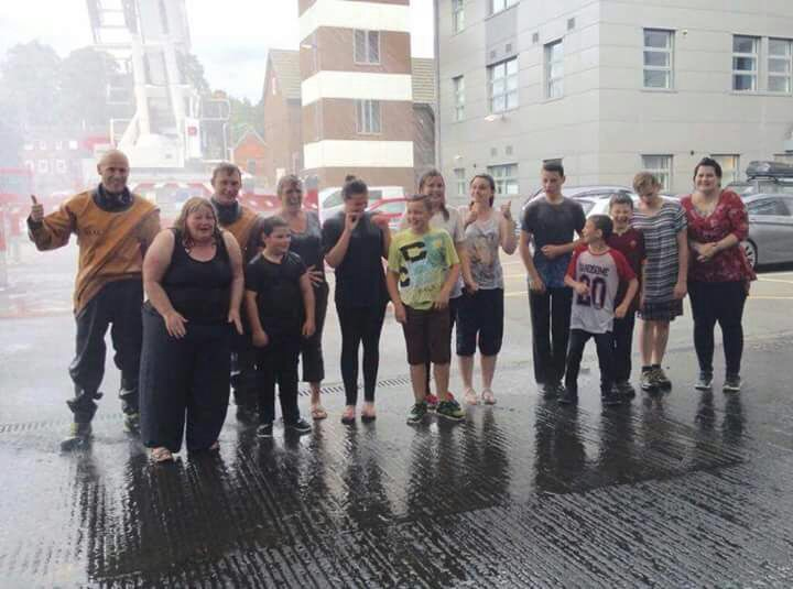 They got a bit wet at Shrewsbury fire station but they had fun. Pictured with firefighters Andrew Sullivan and Andy Davies.
