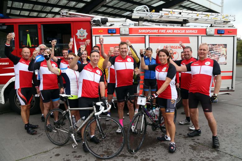 Champagne corks popped at the end of a marathon three day charity cycle ride in aid of The Severn Hospice and the Fire Fighters Charity by members of Shropshire Fire and Rescue Service.