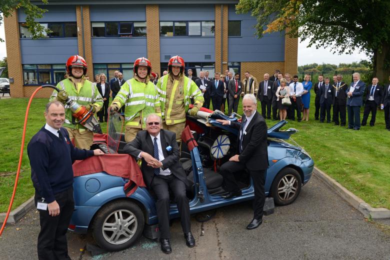 Lord Digby Jones with left to right Shropshire Chief Fire Officer John Redmond and TTC Group Road Safety Director Alan Prosser with firefighters after a car extrication demo as part of the business driver road safety campaign. 