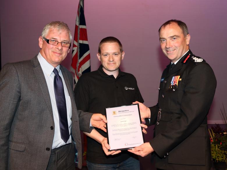 Hero Stuart Pugh and Veolia’s Operations Manager, Mark Hunter, receive the commendation on behalf of colleagues Sean Lane and Dave Trow after the trio rescued a couple from a burning car.
