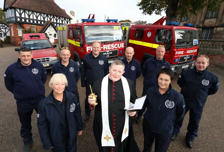 Canon Jonathan Mitchell, the Dean of Shrewsbury Cathedral, blesses the fire engines in a traditional ceremony in Shrewsbury before the trip to Romania. He is pictured with Ann Lewis (left) and Jean Jones with (back row) firefighters Scott Hurfield and John Hammond with Steve Worrall, Shropshire and Wrekin Fire Authority member Councillor Mal Price, Mark Briscoe and Steve Purslow. 