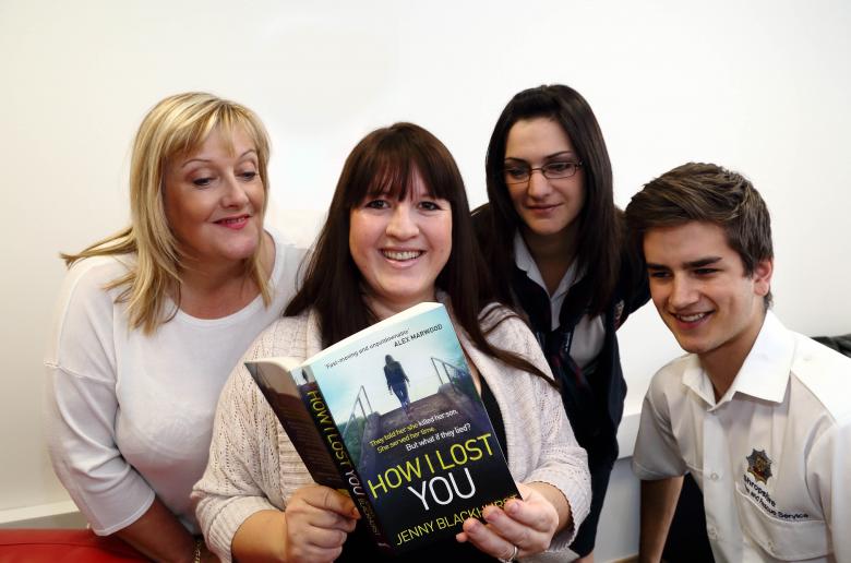 Fire service colleagues take a peek at Jenny Blackhurst's debut novel: left to right Maxine Titley, Jenny, Rachel Harrison and Dan Adams